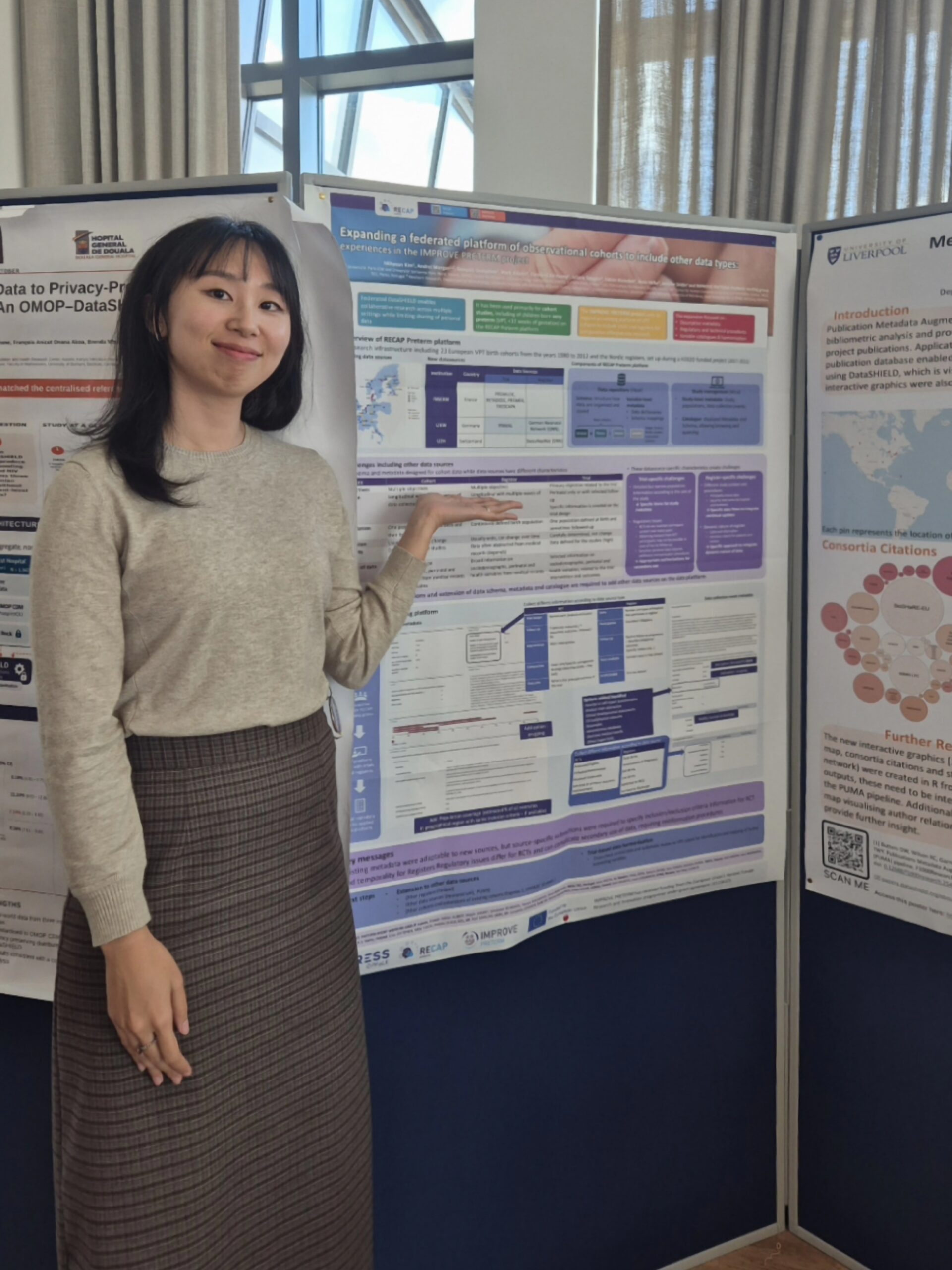 Mihyeon Kim standing beside her IMPROVE PRETERM research poster on federated health data platforms at the DataSHIELD Conference 2026 in Liverpool.
